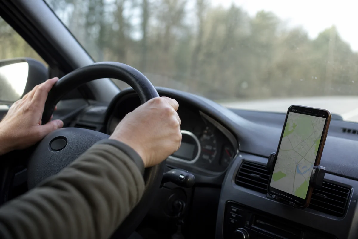 Using your phone at the wheel: what UK law really allows, what it bans and the £200 penalty